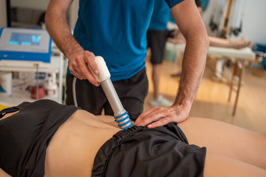 Detail Of A Physiotherapist Giving A Massage In A Clinic.