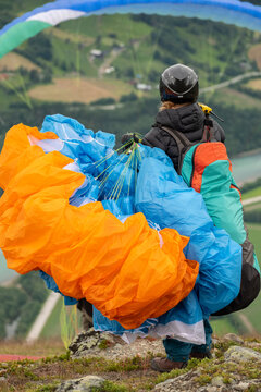 Young girl Paraglider Pilot Prepares His Wing