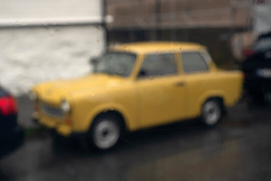 Views through the glass. Rainy day. A parked car