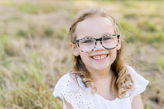 Portrait of a young blonde smiling girl