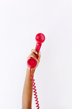 Crop black woman with telephone handset