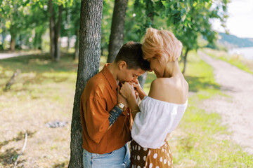 Woman with short hair making a marriage proposal to her partner