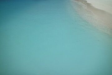 Areal view of crystal clear water and beach in Maldives