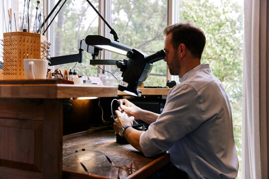 A goldsmith working on a ring