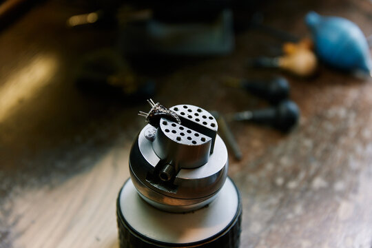 A goldsmith working on a ring