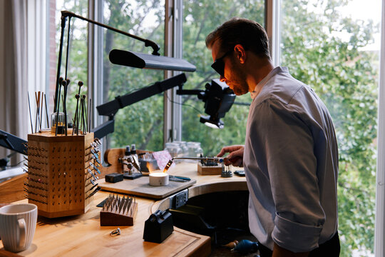 Jeweler using torch