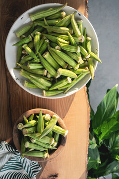 Topview of Fresh Organic Okra on a wooden table