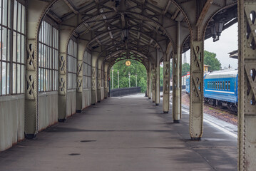 Train stands by the platform.