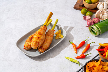 sate lilit is a satay variant in Indonesia, originating from Balinese cuisine. This satay is made from minced chicken and spiced minced meat is wound around lemongrass sticks then grilled on charcoal