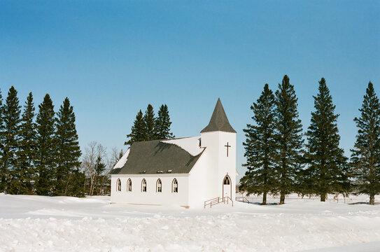 Picture of a white church in the snow