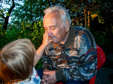 retirement: grandkid play with grandfather 