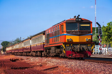 Fototapeta premium Passenger train by diesel locomotive on the railway.