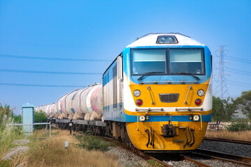 Fototapeta premium Tanker-freight train by diesel locomotive on the railway.