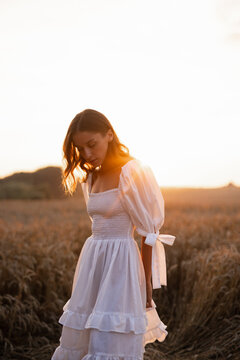 Girl in airy dress taking rest in nature 