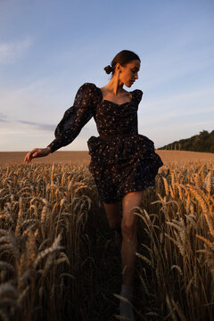 Woman in stylish garment enjoying nature around her 