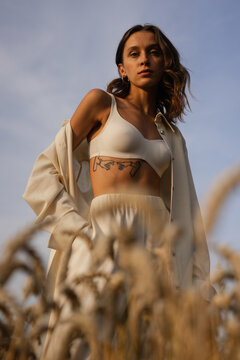 Female model in loose-fitting garment looking at camera 