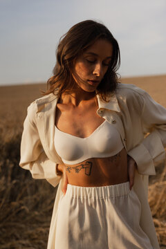 Female model in silk suit in nature 