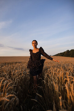 Girl strolling through barley 