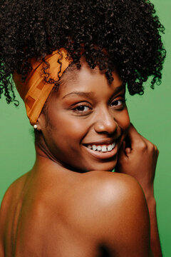 Cheerful black woman in topless