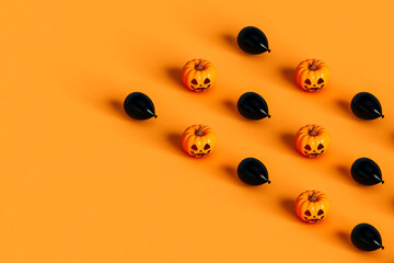 rows of Halloween pumpkin and black balloon