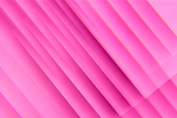 Pink abstract colorful geometric lines made of paper