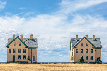Two abandoned houses in the field