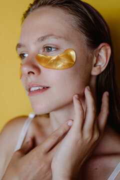 Woman with cosmetic patches on her face