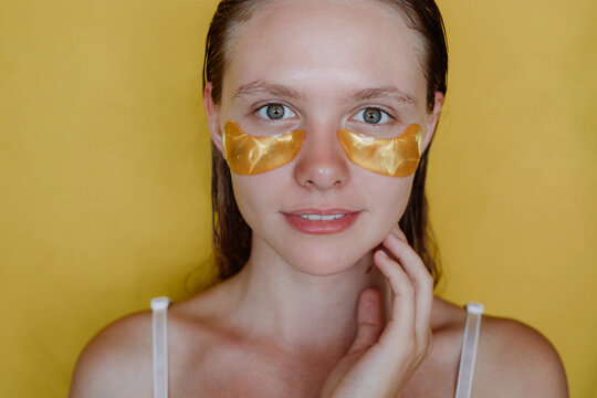 Woman with cosmetic patches on her face