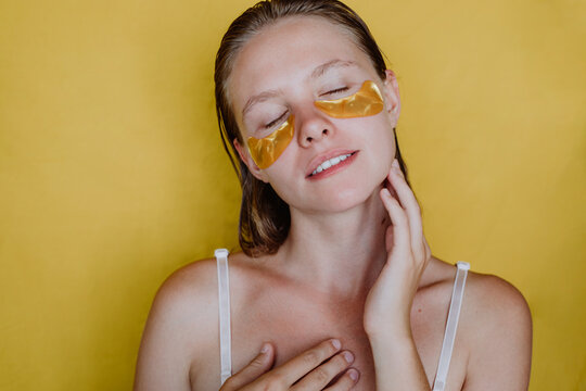 Woman with cosmetic patches on her face