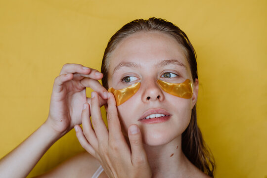 Woman with cosmetic patches on her face