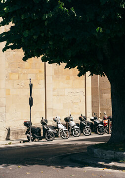 Row of scooters parked up in Italy.