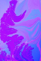 Abstract lilac marble background. Acrylic paint spreads freely and creates an interesting pattern. Background for the cover of a laptop, notebook.
