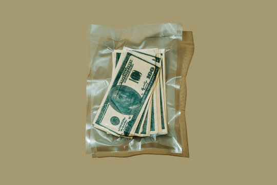 vacuum packed bag of dollar bills