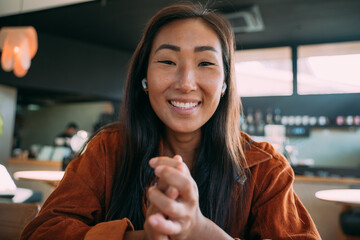 Casually dressed  woman POV video call