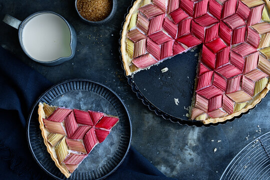 Geometric rhubarb tart with slice removed