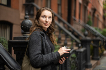 Woman in front of apartment buildings