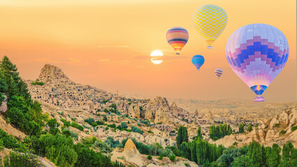 hot air balloons over Goreme town in Cappadocia Turkey during sunrisie
