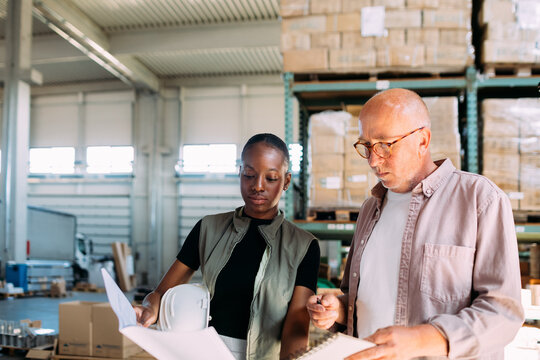 Man and Woman Working in Factory 