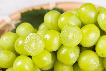 closeup of seedless green Shine Muscat grape on table