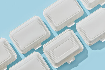 Disposable lunch boxes in two rows.