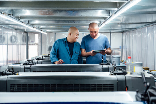 Asian workers in printing industry
