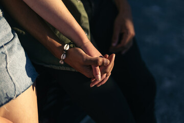 Close-up of couple holding hands