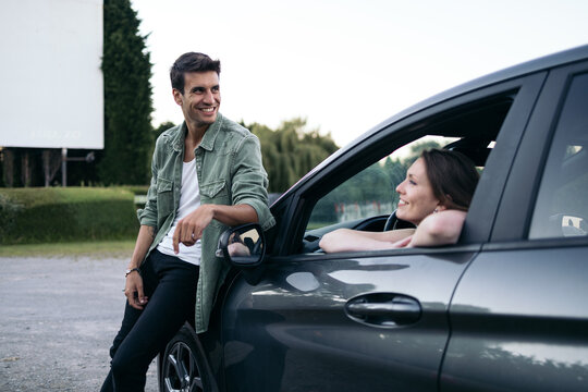 Couple dating at an outdoor drive-in movie theater