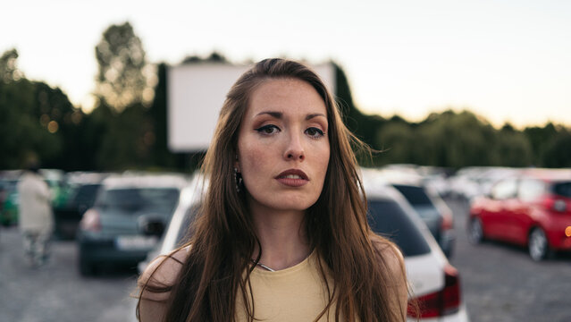 Young woman at a drive-in movie theater