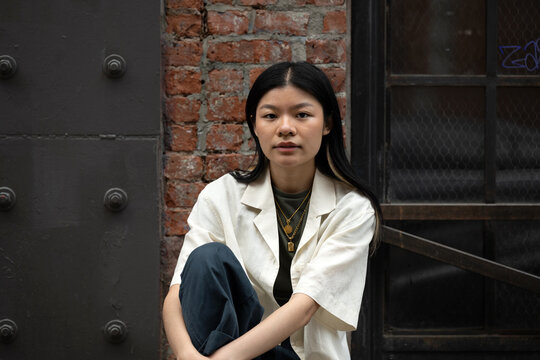 Portrait of young woman in street