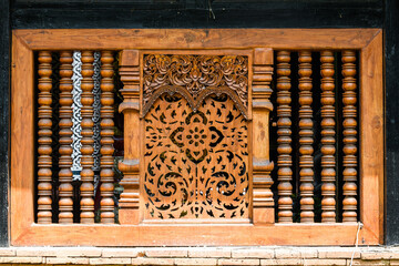 an ancient window with light and shadow in Chiang Mai (Wat Lok Moli)