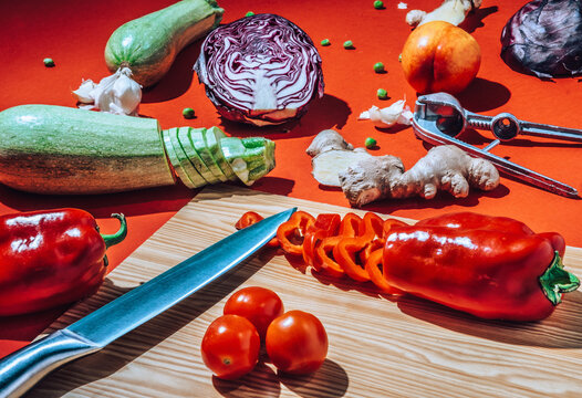 Sliced Veggies And Knife On Cutting Board