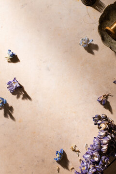Rustic Flatlay Blue Floral and Warm Stone Background