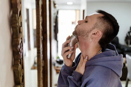 Portrait of a man shaving