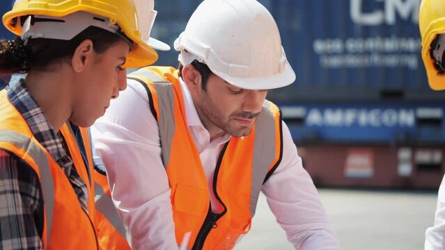 Industrial engineer meeting and exchange ideas in industry area. Engineer wearing safety helmet at factory. Concept of industry, factory, environment and professional people.